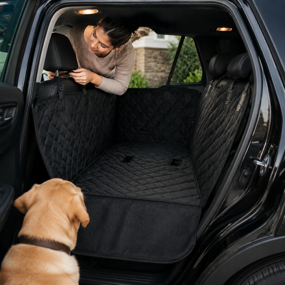 Owner installing the CleanRide hammock headrest strap in an SUV